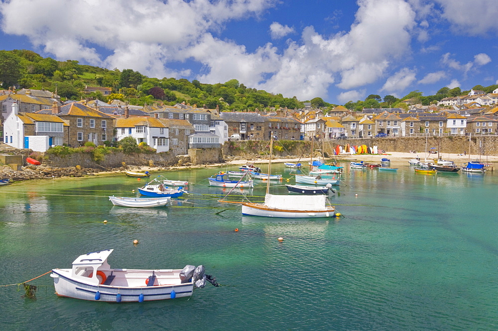 Small fishing boats in the enclosed harbour at Mousehole, Cornwall, England, United Kingdom, Europe