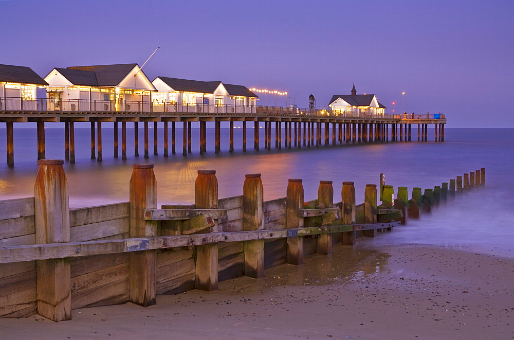 Southwold pier and wooden groyne at sunset, Southwold, Suffolk, England, United Kingdom, Europe