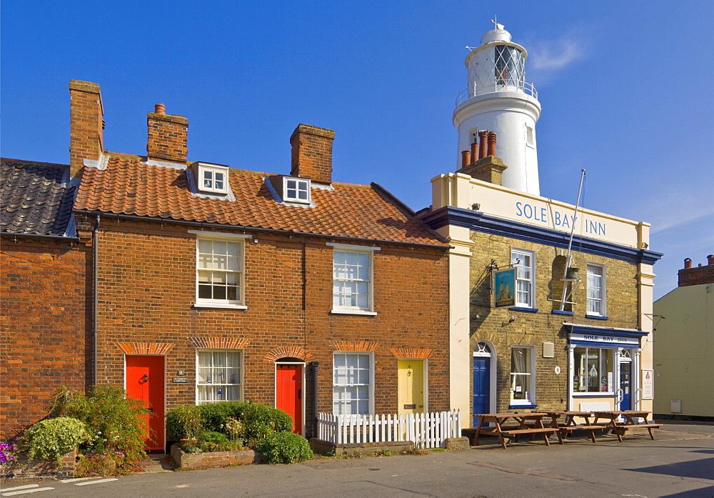 The Sole Bay Inn pub with Southwold lighthouse behind, Southwold, Suffolk, England, United Kingdom, Europe