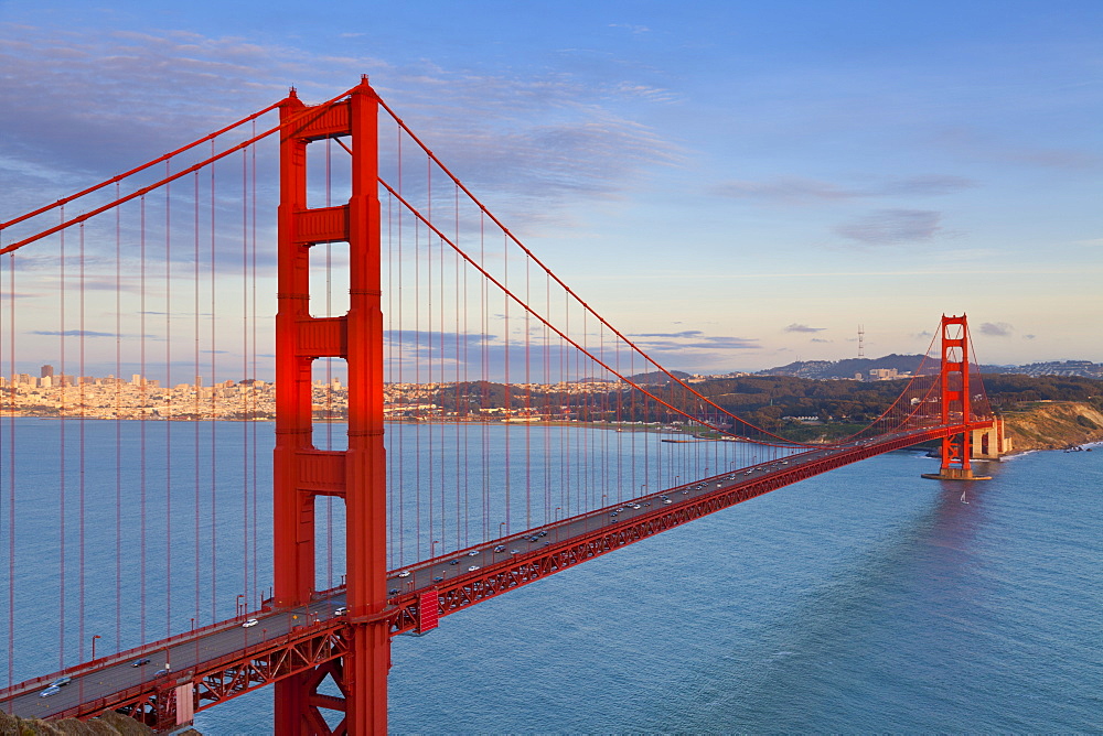 The Golden Gate Bridge, linking the city of San Francisco with Marin County, taken from the Marin Headlands at sunset with the city in the background, Marin County, San Francisco, California, United States of America, North America