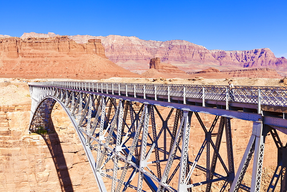 Lone tourist on Old Navajo Bridge over Marble Canyon and Colorado River, near Lees Ferry, Arizona, United States of America, North America 