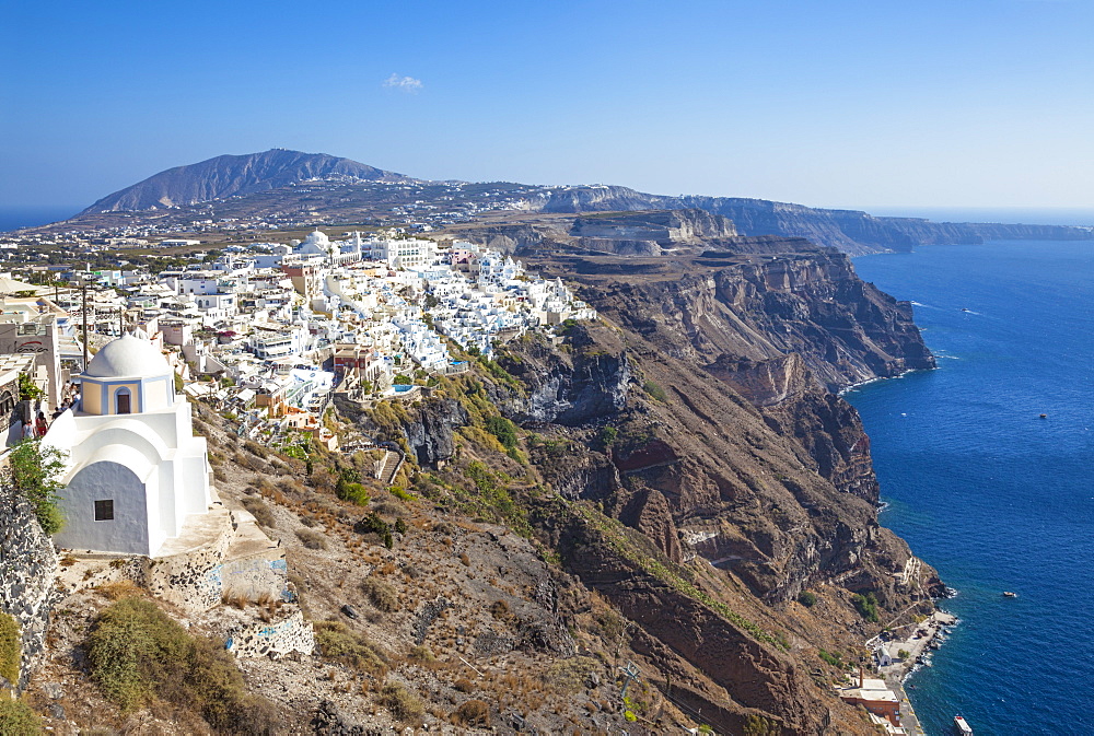 Fira town and greek Church of Saint Stylianos, Firostefani, Santorini (Thira), Cyclades Islands, Greek Islands, Greece, Europe