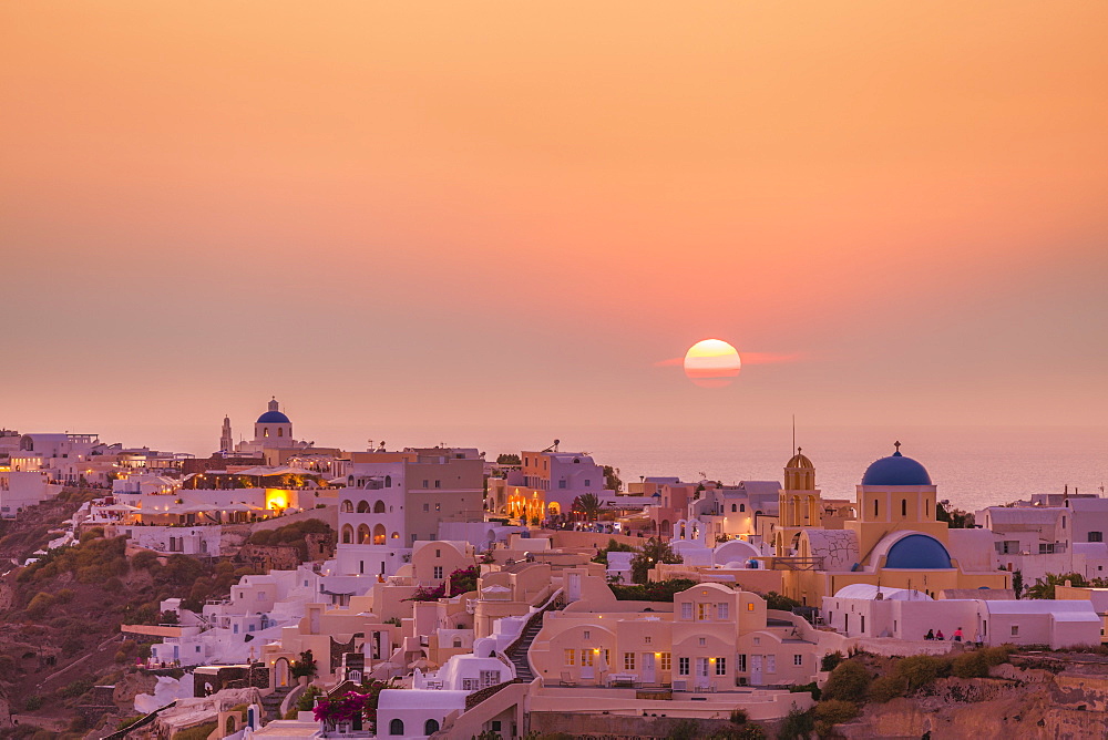 The village of Oia in the evening at sunset, Santorini (Thira) Cyclades Islands, Greek Islands, Greece, Europe