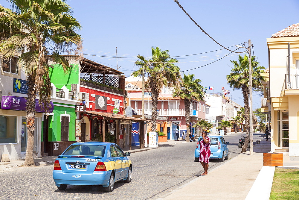 Local taxi driving down the main street, Rua 1 de Junho, Praca Central, Santa Maria, Sal island, Cape Verde, Africa