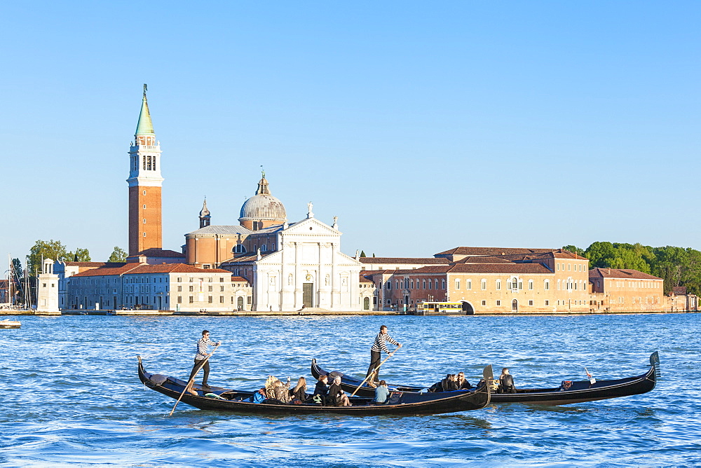 Venetian gondolas with tourists opposite the Island of San Giorgio Maggiore, on the Canale di San Marco, Venice, UNESCO World Heritage Site, Veneto, Italy, Europe