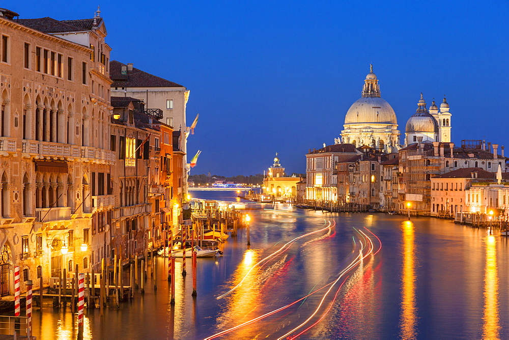 Grand Canal, and the church of Santa Maria della Salute, at night, with boat light trails, Venice, UNESCO World Heritage Site, Veneto, Italy, Europe