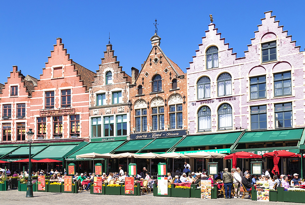 Cafes in the Market Square in the centre of Bruges, West Flanders, Belgium, Europe