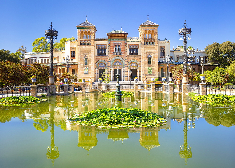 Reflections in the pool opposite the Museum of Popular Arts and Traditions, Seville, Andalusia, Spain, Europe