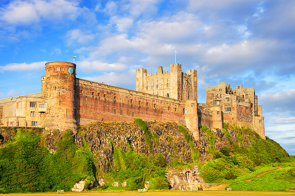 Bamburgh Castle and Bamburgh Castle walls from Bamburgh Village, Northumberland, England, United Kingdom, Europe