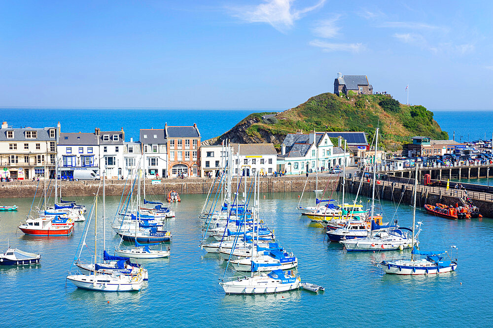 Ilfracombe harbour with yachts and St. Nicholas Chapel overlooking the town of Ilfracombe, Devon, England, United Kingdom, Europe