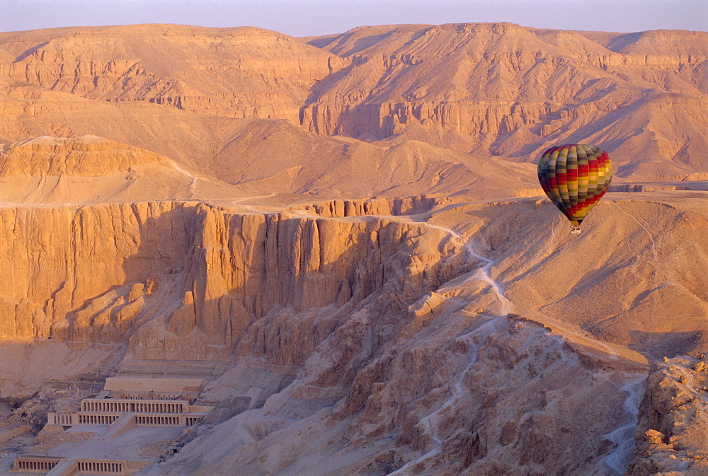 Hot air balloon floating over the Temple of Hatshepsut, Valley of the Kings, Luxor, West Bank, Egypt 