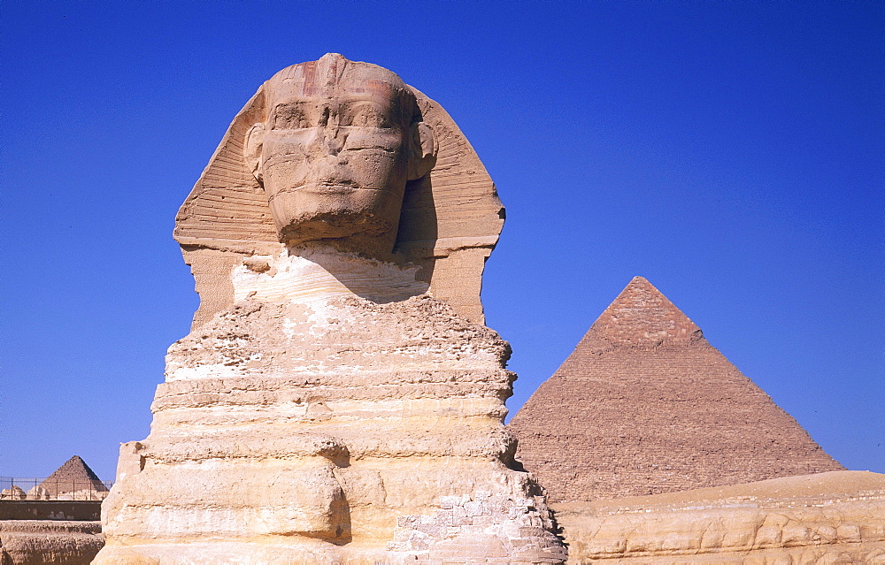 The Sphinx and one of the pyramids at Giza, Cairo