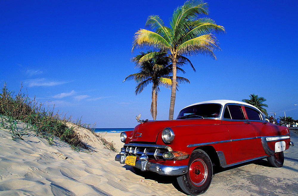 Santa Maria del Mar, American red car, the beach of the East -Havana, Cuba, Central America