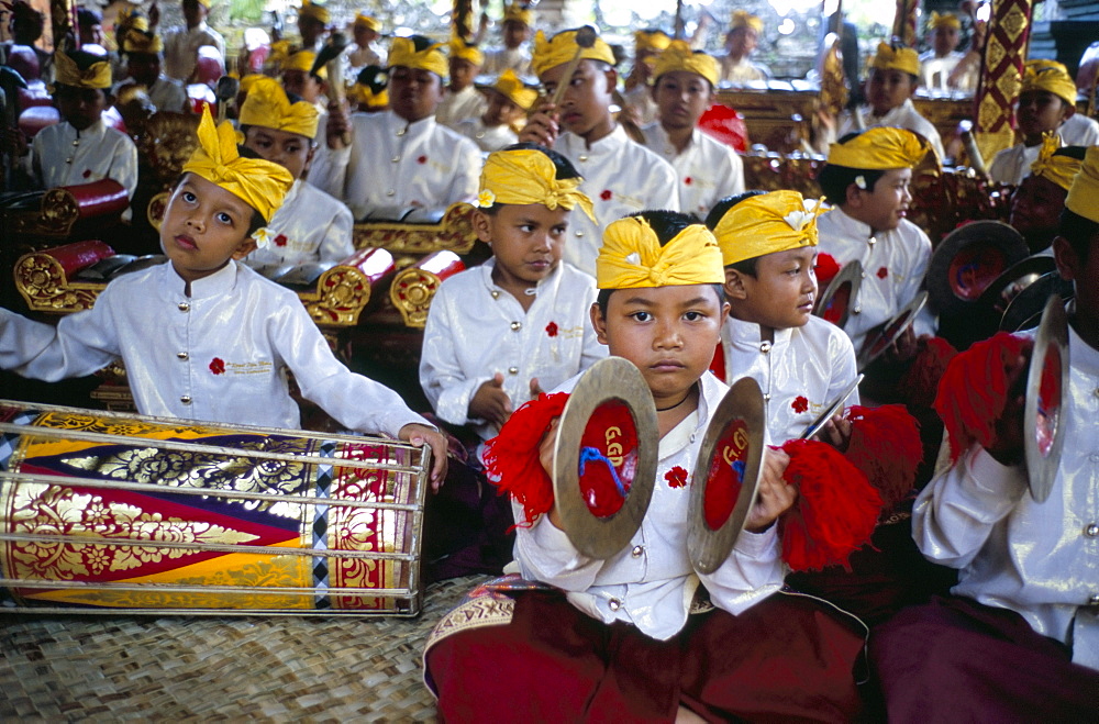 Child musicians at Odalan ceremony, temple of Bataun, island of Bali, Indonesia, Southeast Asia, Asia