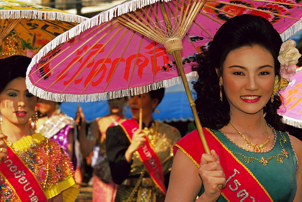 Thai queens holding typical umbrellas during King Narai Reign Fair, festival held in Lopburi, Thailand, Southeast Asia, Asia