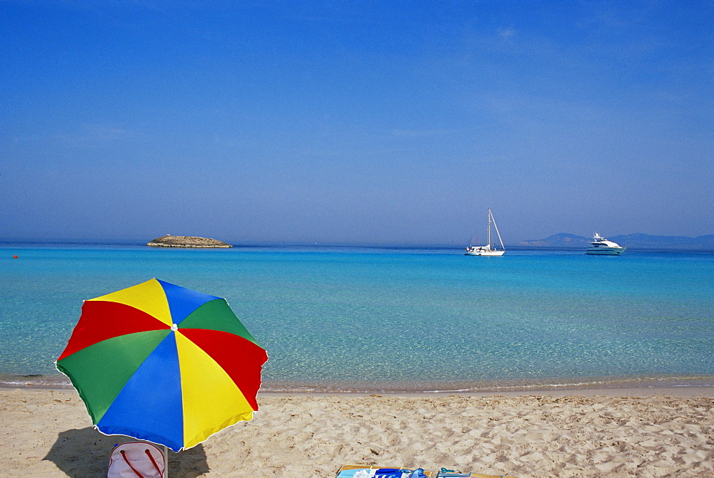 Colourful umbrella on Playa de ses Illetes beach, Formentera, Balearic Islands, Spain, Mediterranean, Europe