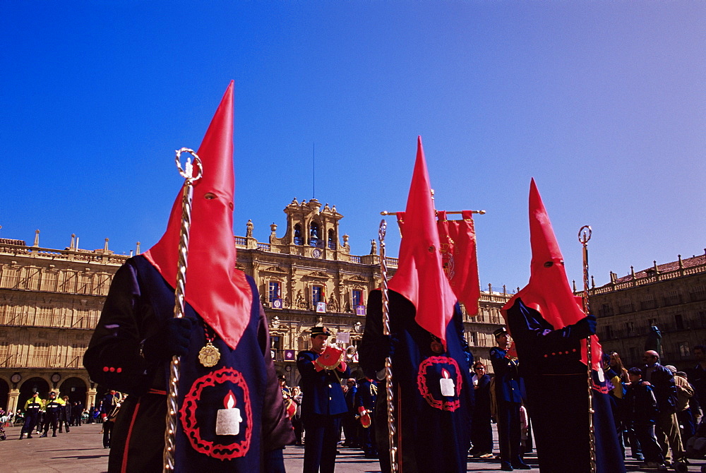 Penitents in the Plaza Mayor during Holy Week procession, Salamanca, Castilla Leon, Spain, Europe