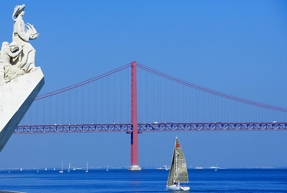 Detail of the Monument to the Discoveries and the 25th April bridge, Belem, Lisbon, Portugal, Europe