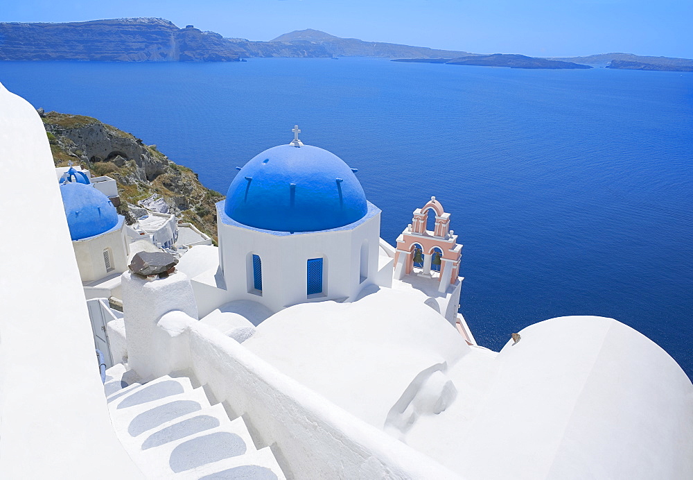 Blue domed church overlooking sea, Oia, Santorini, Cyclades Islands, Greek Islands, Greece, Europe