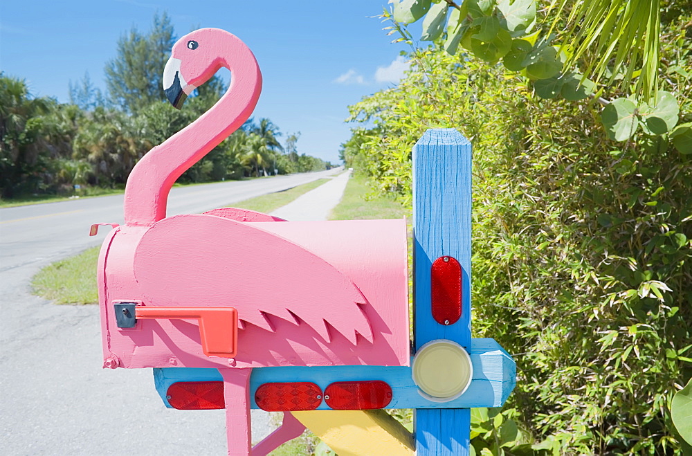 Flamingo made of wood attached to pink mailbox, Sanibel Island, Florida, United States of America, North America