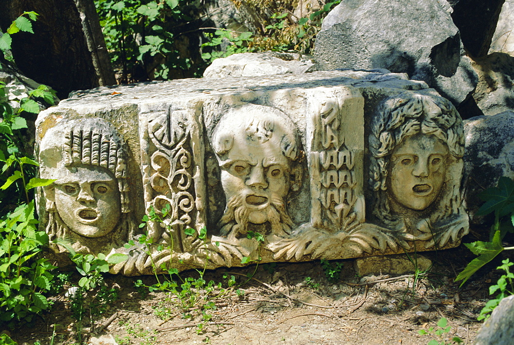 Greek tragic masks scattered among the ruins of ancient Myra, Turkey, Eurasia