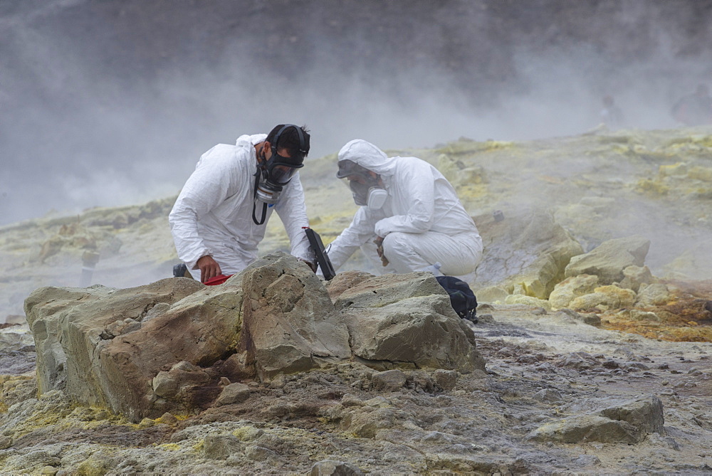 Geologists taking mineral samples on Gran Cratere (The Great Crater), Vulcano Island, Aeolian Islands, UNESCO World Heritage Site, Sicily, Italy, Mediterranean, Europe