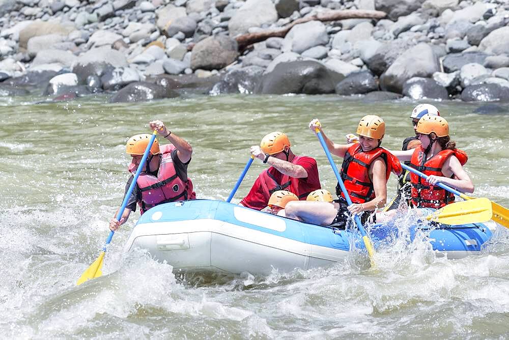 A group of people whitewater rafting, Costa Rica, Central America