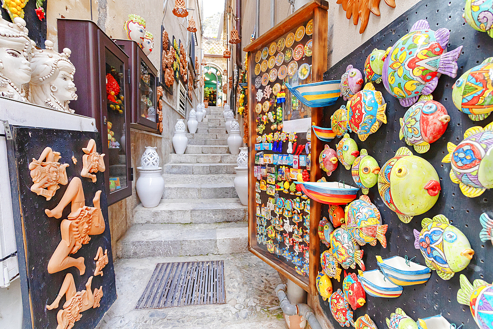 Old town street filled with artwork and souvenirs, Taormina, Sicily, Italy, Mediterranean, Europe