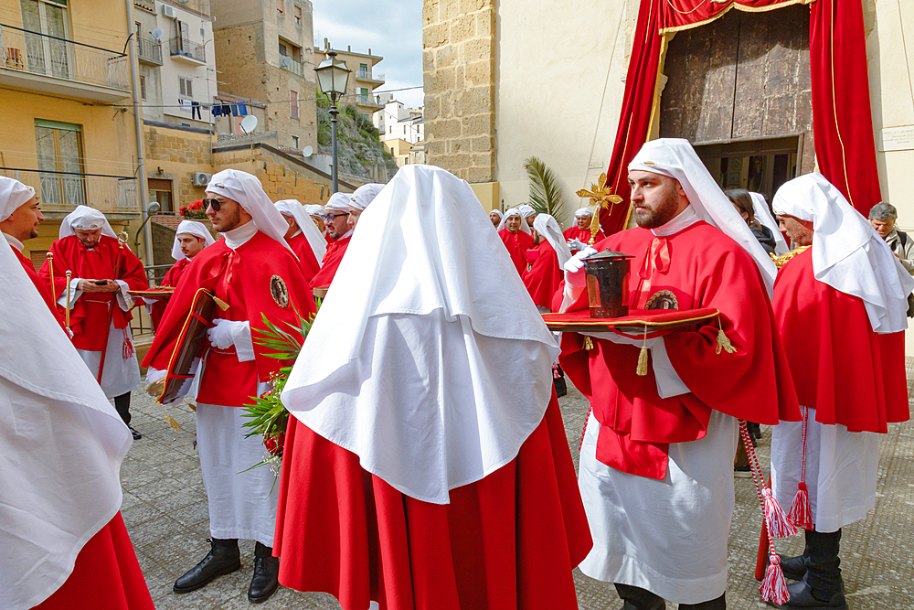 Confraternity of penitents gathering outside San Leonardo church, Enna, Sicily, Italy, Mediterranean, Europe