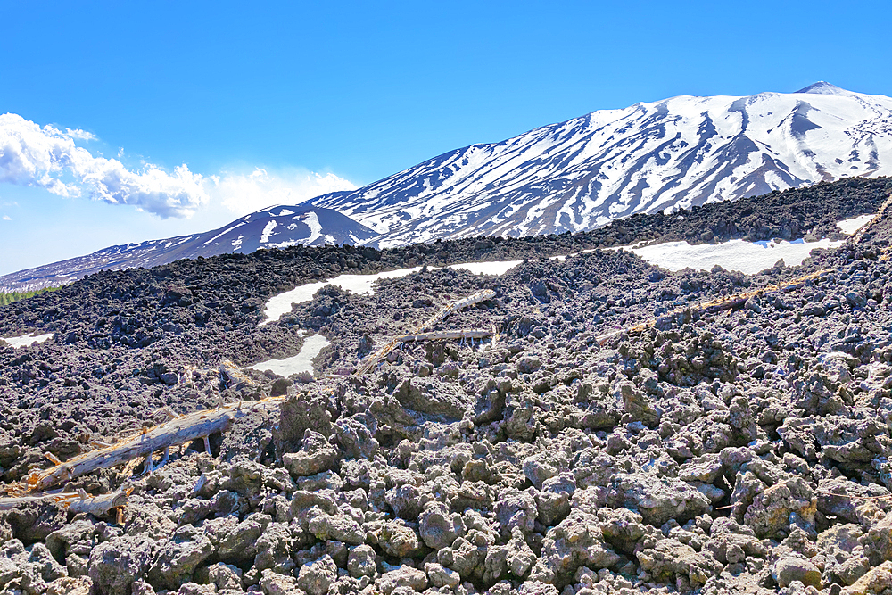 View of lava fields and snow-capped peaks in the distance, Etna, Sicily, Italy, Mediterranean, Europe