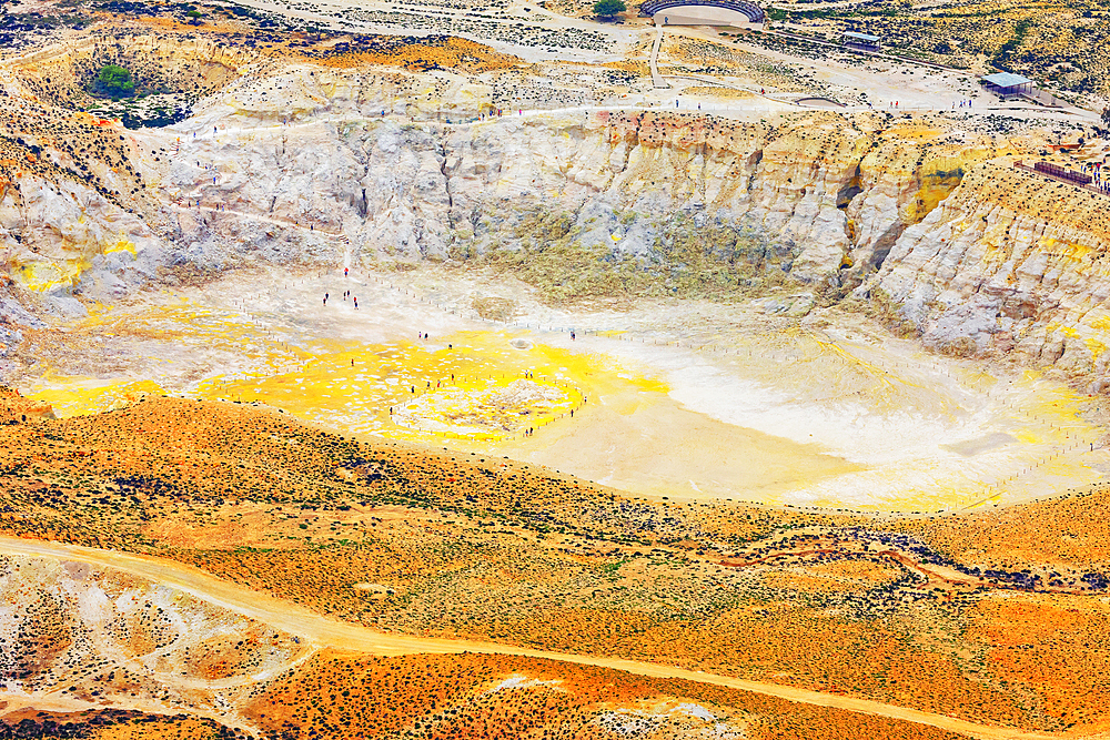 People walking around Stefanos crater moonlike landscape, Nisyros Island, Dodecanese Islands, Greece