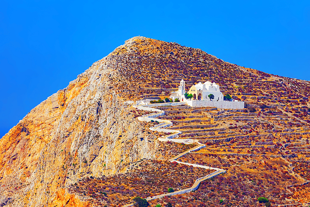 View of Panagia Kimissis church built on a cliff above the sea, Chora, Folegandros Island, Cyclades Islands, Greece