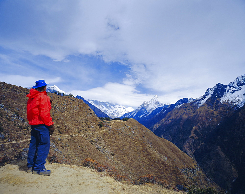 Trekker looking at Ama Dablan and other mountains of the Himalayas, Hotel Everest view, Namche Bazaar, Nepal