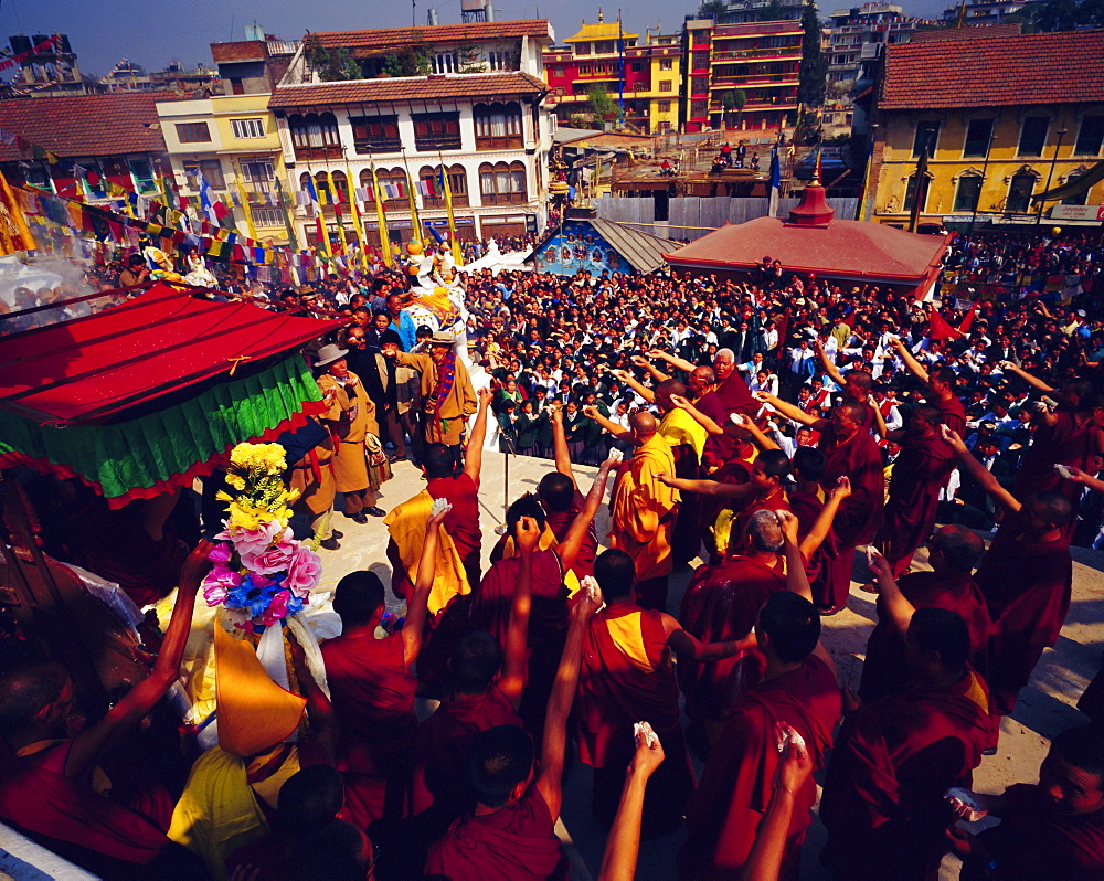 Buddist celebration of Losar (Tibetian New Year) where Buddists throw flower in the air, Bodnath, Katmandu, Nepal, Asia