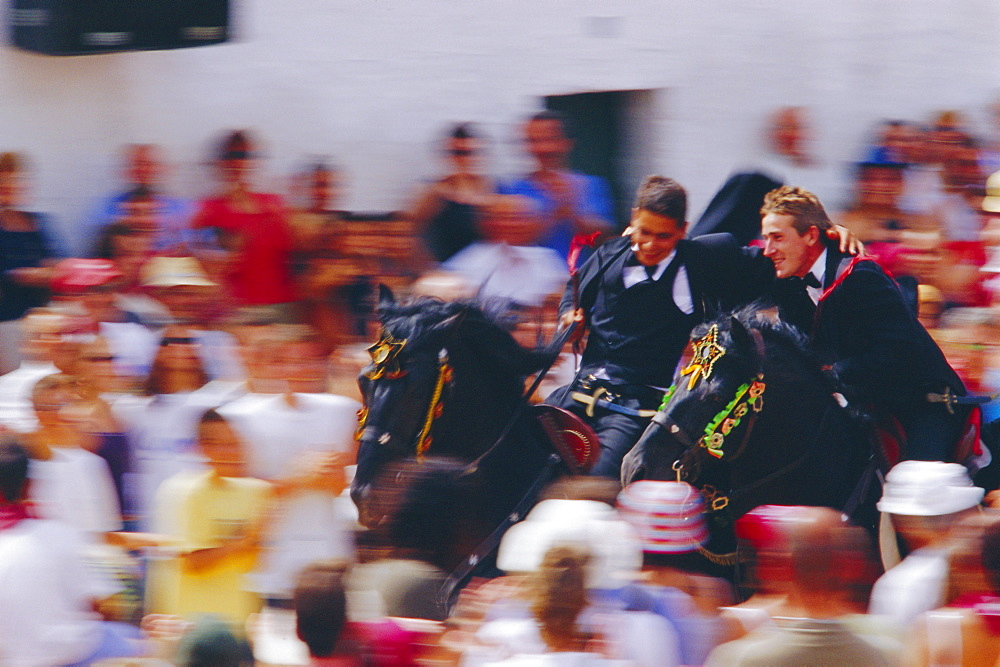 Horsemen riding together during the Sant Joan's festival, Ciutadella, Minorca, Spain