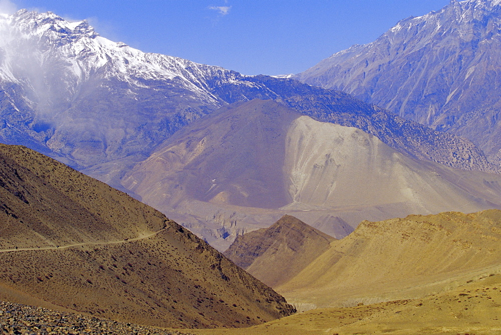 Arid landscape and colourful mountains, on route from KaGBeni to Khingar, Southern Mustang, Nepal