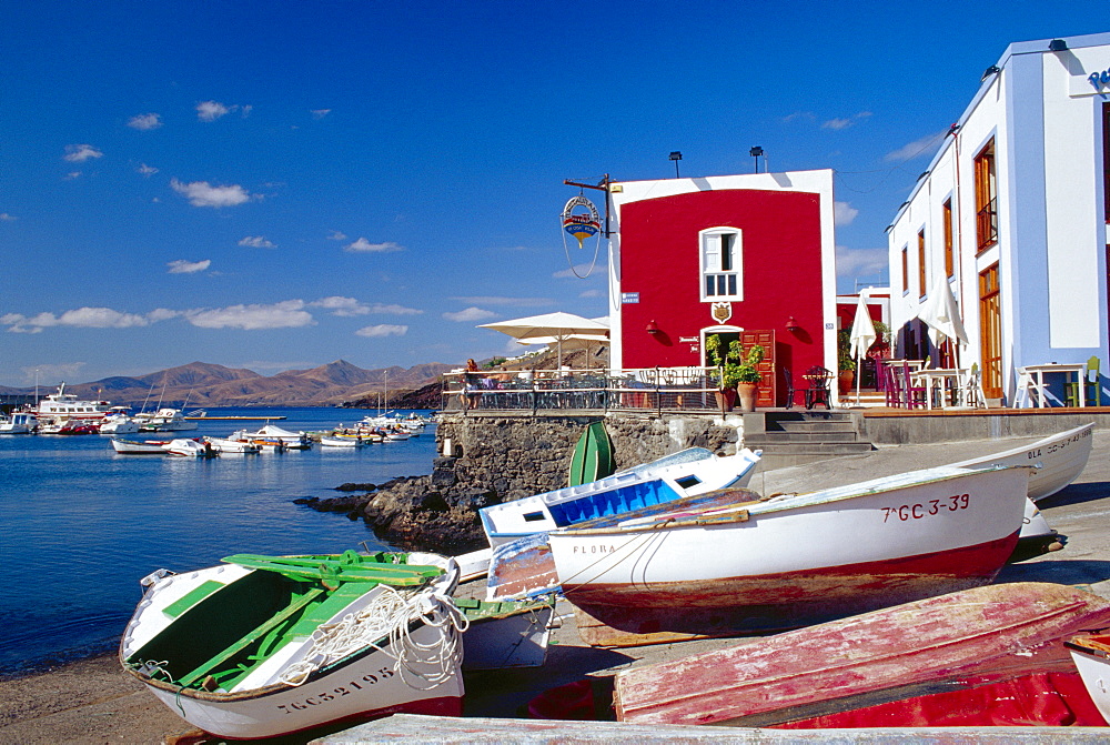 Boats and old red house, Old Port, Puerto del Carmen, Lanzarote, Canary Islands, Spain 