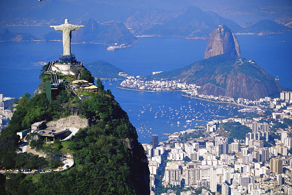 Statue of Christ the Redeemer overlooking city and Sugar Loaf mountain, Rio de Janeiro, Brazil, South America