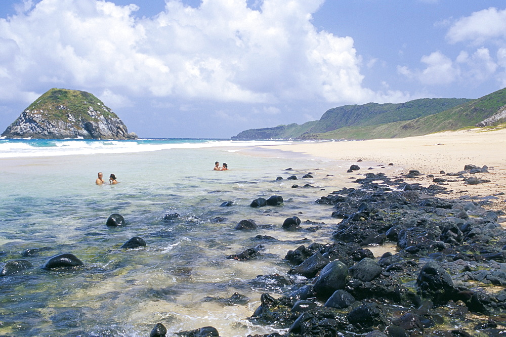 People swimming at Praia do Leao beach, Parque Nacional de Fernando de Norohna, Fernando de Noronha, Pernambuco, Brazil, South America