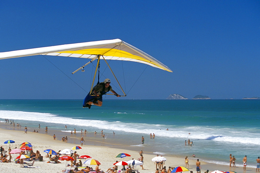 Hang-glider landing on Pepino beach, Rio de Janeiro, Brazil, South America