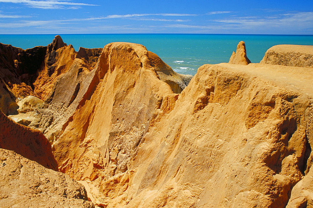 Red rock formations of Morro Branco on the Ceara coastline, near Canoa Quedrada, Ceara', Brazil, South America