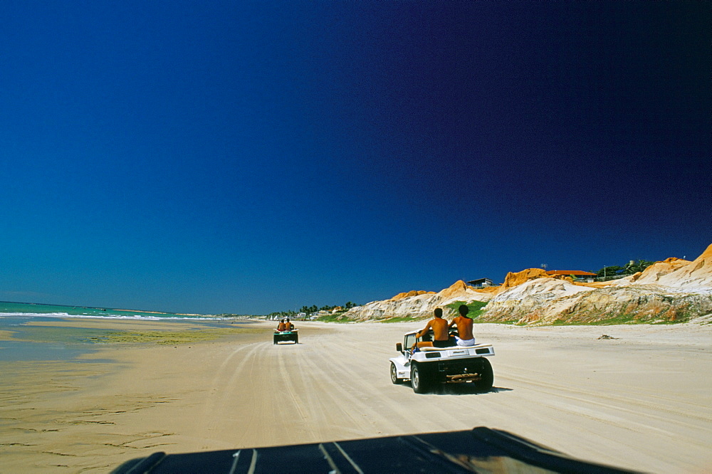 Beach buggies running on the Ceara coastline, ner Canoa Quedrada, Ceara', Brazil, South America