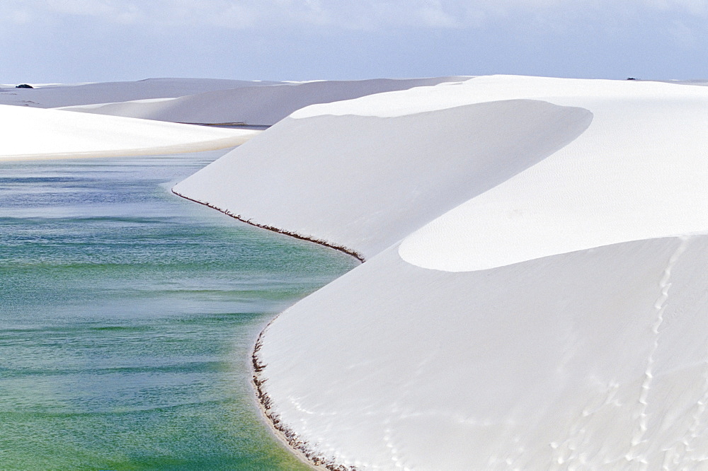 Lagoa Azul (Blue lagoon) and sandy dunes at Parque Nacional dos Lencois Maranhenses, Brazil, South America