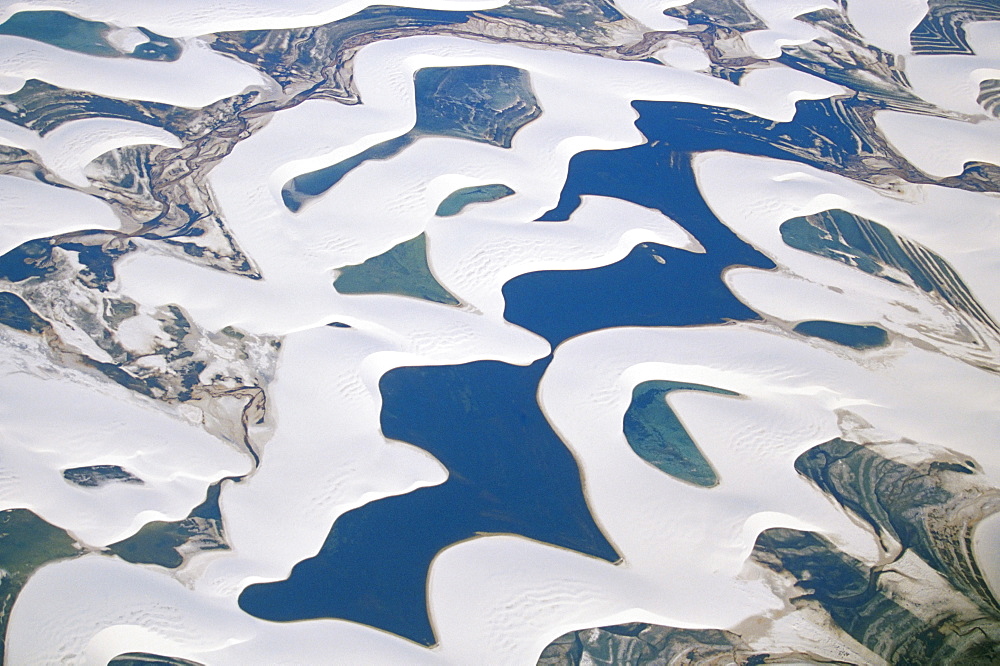 Aerial view of the sandy dunes and lagoons, part of Parque Nacional dos Lencois Maranhenses, Brazil, South America