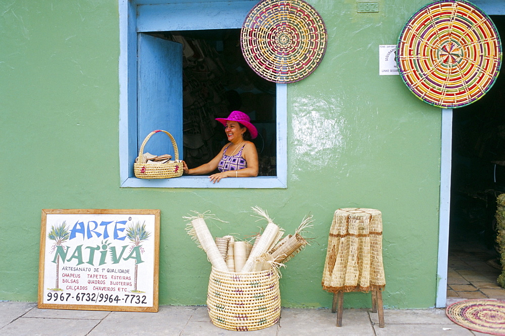 Hat seller in the window of her shop, Barreirinhas, Lencois Maranhenses, Brazil, South America