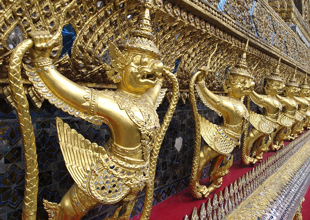 Garudas and nagas on external decorations of the Ubosoth, Wat Phra Kaew temple, Grand Palace, Bangkok, Thailand