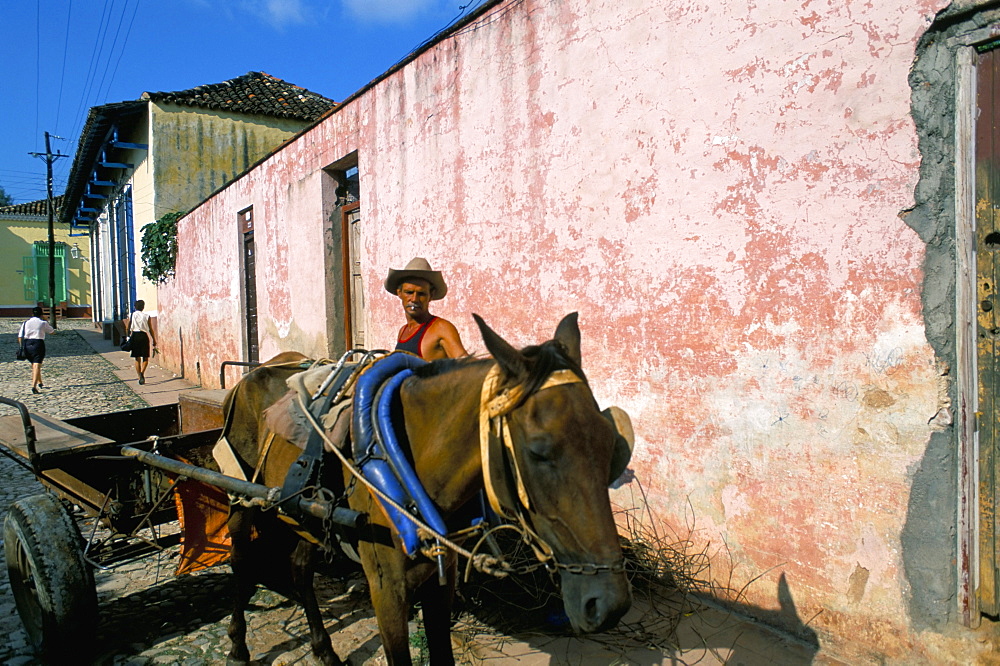 Horse-drawn cart in street of the colonial city, Trinidad, Sancti Spiritus region, Cuba, West Indies, Central America