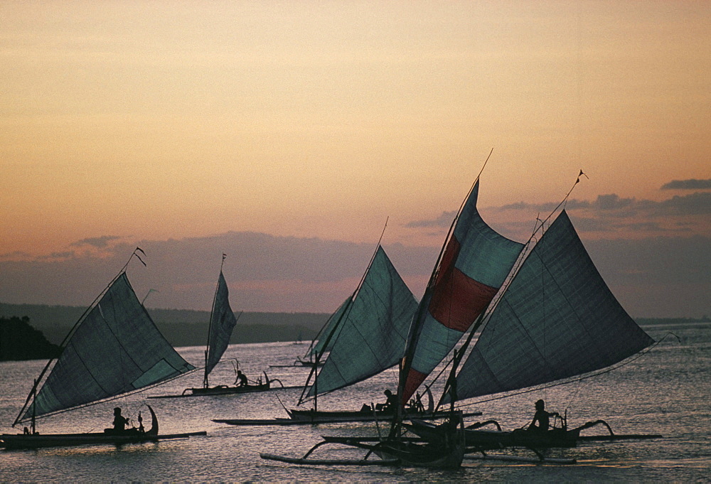 Outrigger fishing boats under sail, returning to the village of Bunutan, eastern region, island of Bali, Indonesia, Southeast Asia, Asia