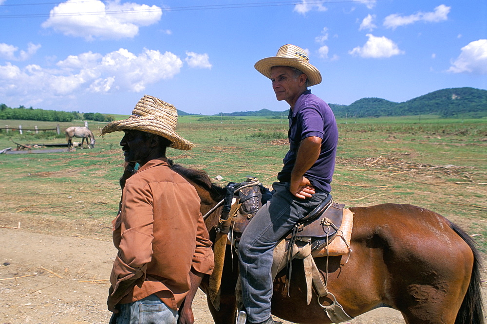 Men on the Guainamaro sugar plantation, Valley de los Ingenios, Sancti Spiritus region, Cuba, West Indies, Central America