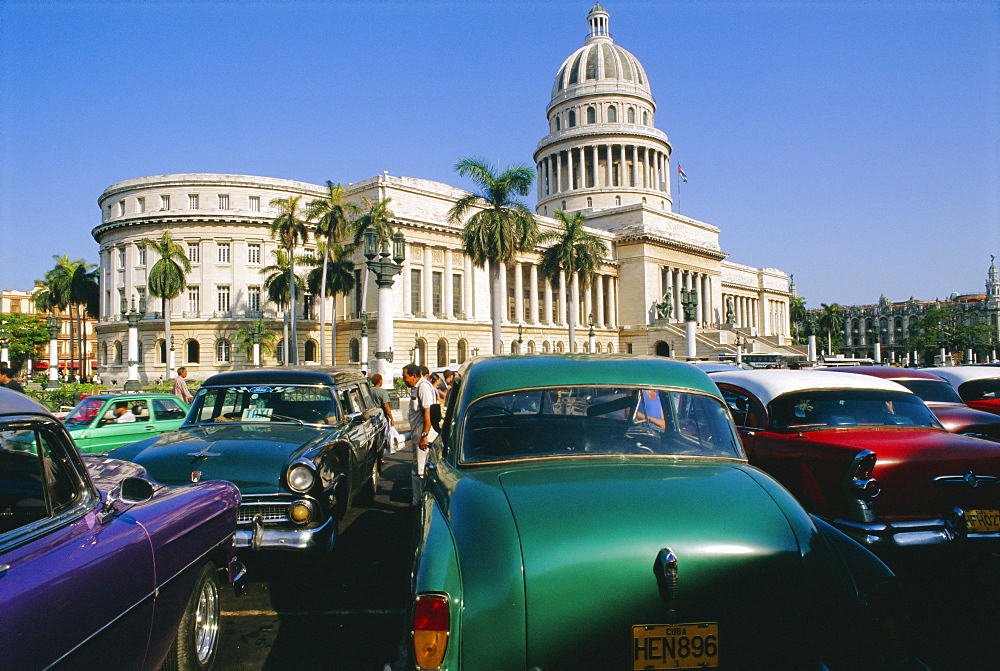 Old 1950's American cars outside El Capitolio Building, Havana, Cuba 